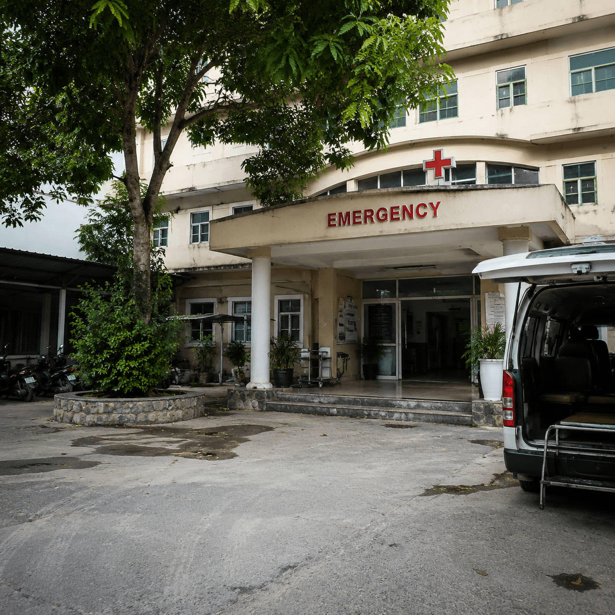 Photorealistic editorial travel photograph in Vietnam. Subject: Ha Giang hospital emergency entrance.  for the "Mountains & Trekking" section of a Vietnam travel guide. Editorial inline photo, natural