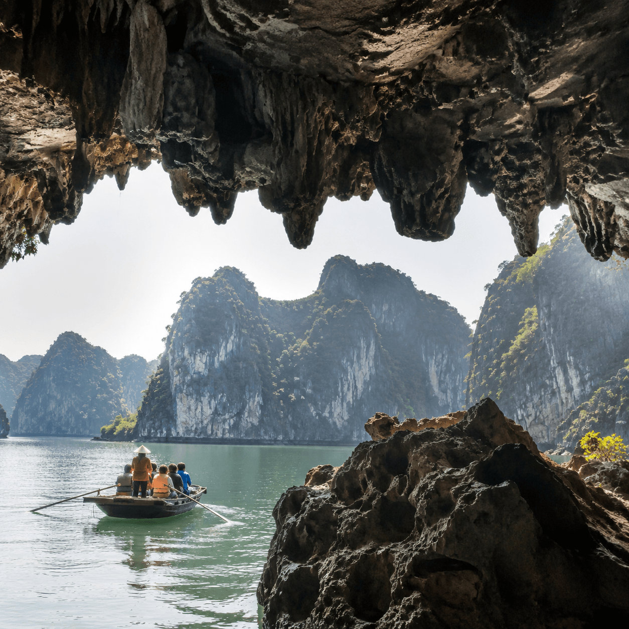 Photorealistic editorial travel photograph in Vietnam. Subject: Hang Tien Ong cave Ha Long Bay.  for the "Nature & Adventure" section of a Vietnam travel guide. Wide cinematic hero-banner composition,