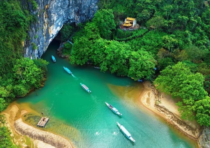 Riverside view of Phong Nha town with boats moored on the Son River