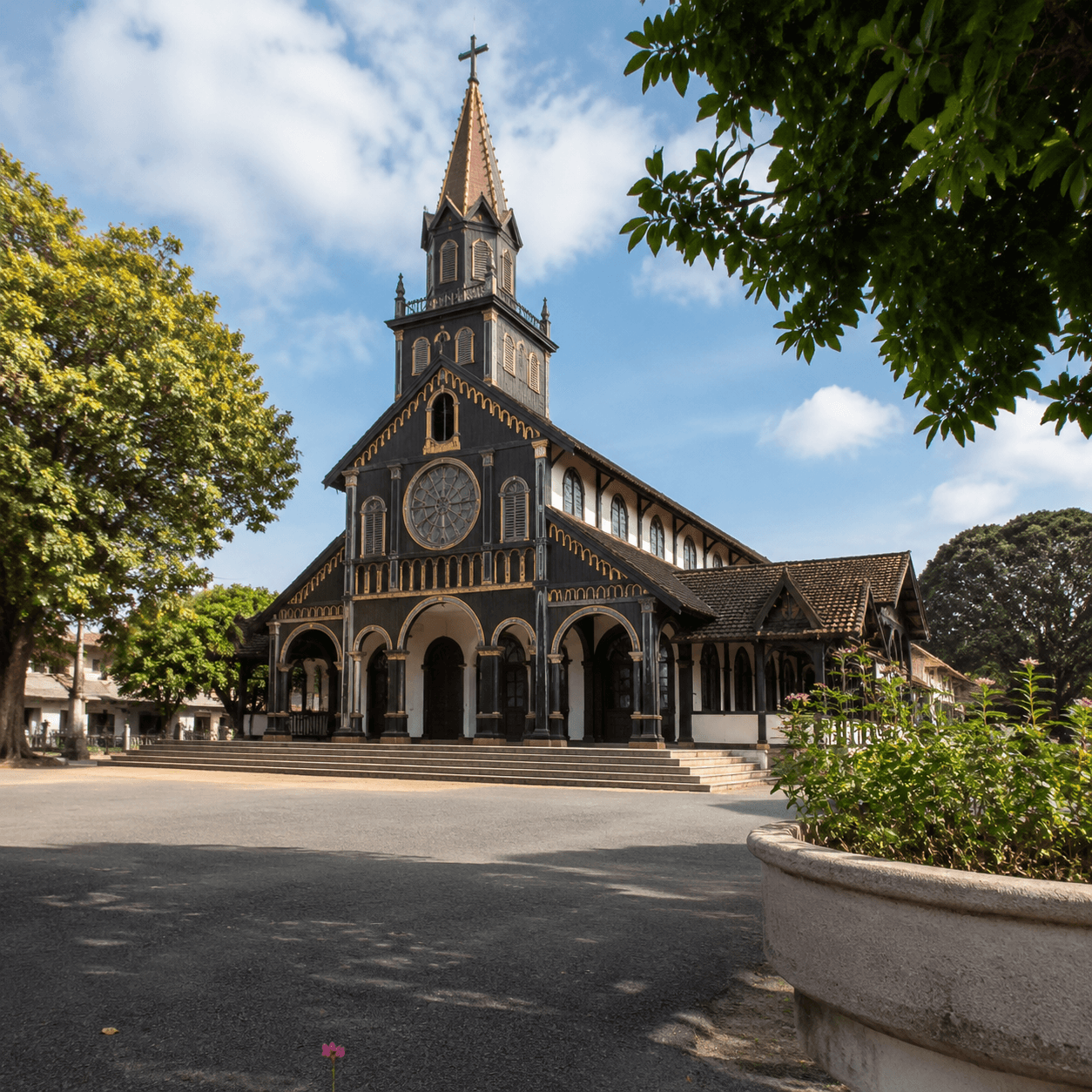 Photorealistic editorial travel photograph in Vietnam. Subject: Kon Tum Wooden Church. for the "Itinerary" section of a Vietnam travel guide. Editorial inline photo, natural 4:3 composition, detail a