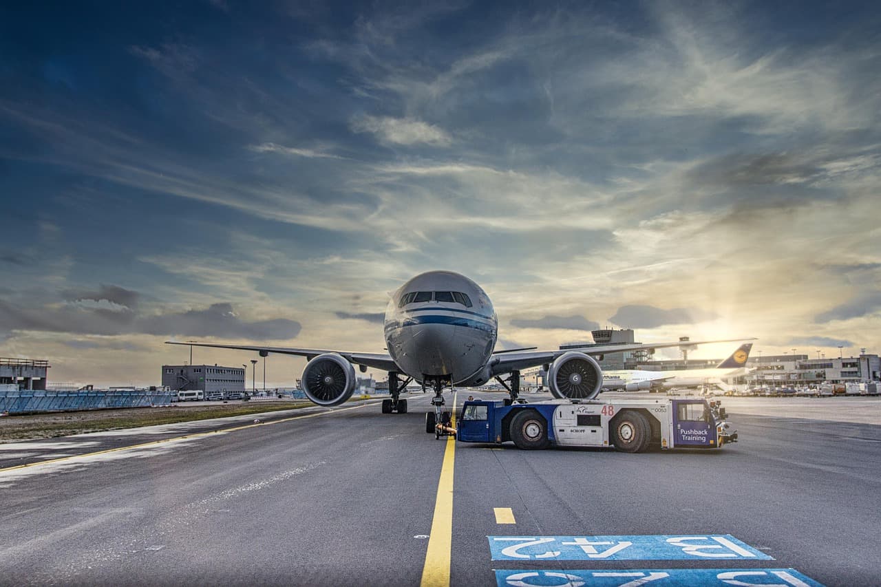 airplane, runway, airport, tarmac, aircraft, vehicle, nature, truck, airliner, clouds, asphalt, jet, flight, transportation system, air travel, outdoor, airline, plane, transportation, travel, airfiel